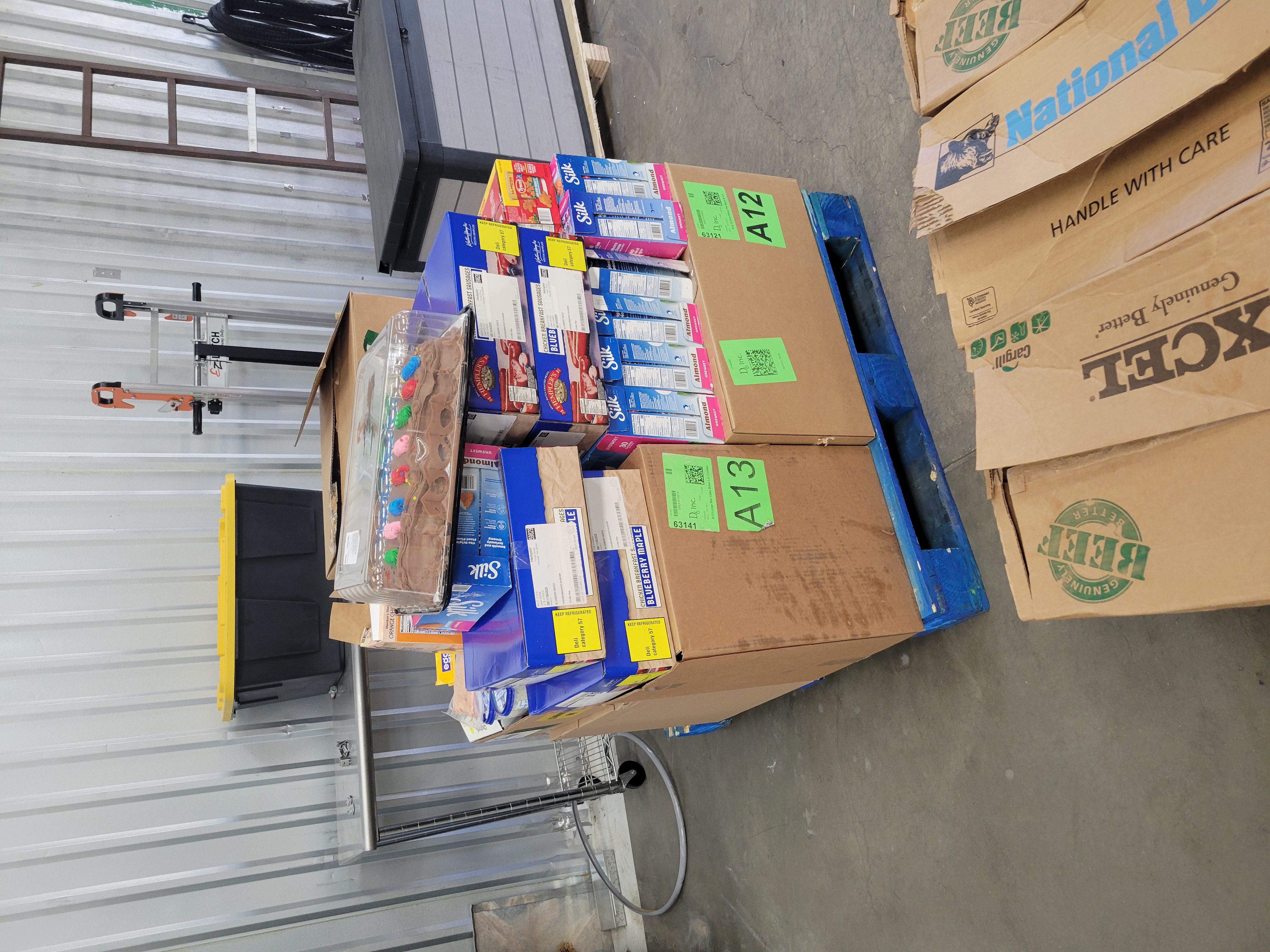 Assorted food in boxes on a pallet.
